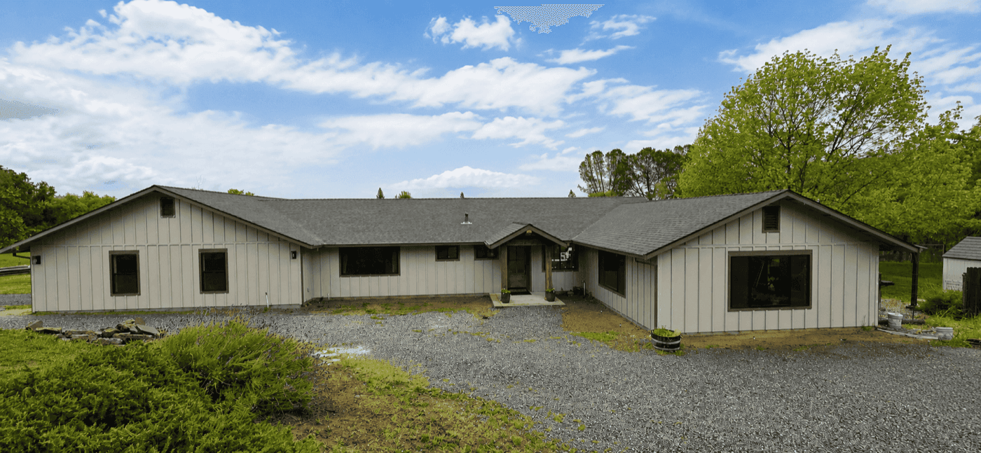 The same home after new siding and finish work