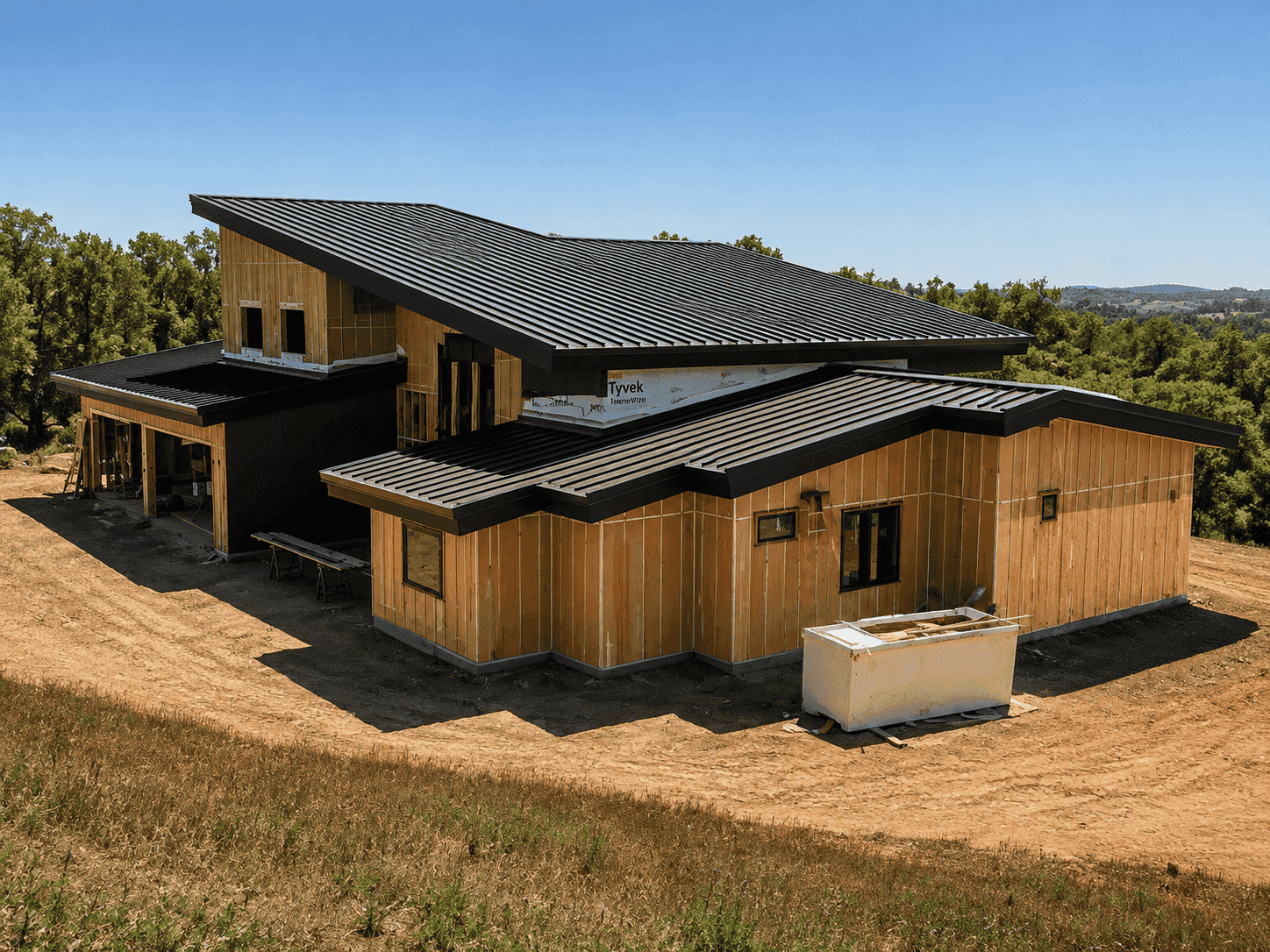 Modern hillside home with a standing seam roof, built by Cademartori Construction in El Dorado County